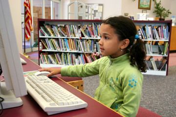 Child in a school library - 6294510