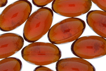 Red gel capsules isolated over white background