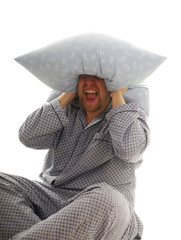 Man cry with pillow on his head