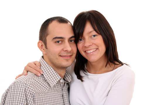 happy couple - woman and man 25-30 years old isolated on white