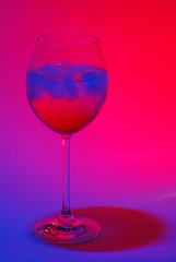 A cocktail in colorful light