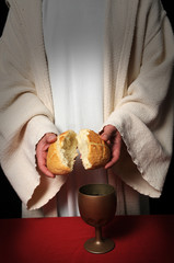 Jesus breaking bread as a symbol of Communion