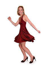 Beautiful woman in red dress expressing happiness