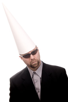 Man in a dunce cap and sunglasses