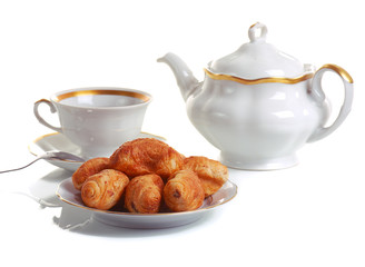 cup of tea and croissants on white