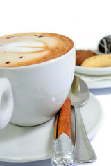 cappuccino with cinamon stick