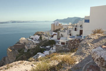 small houses carved into the rock in Oia Village