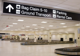 Direction signs in an airport terminal for travelers