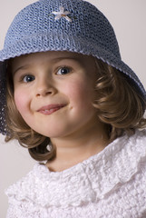 Little girl in summer hat