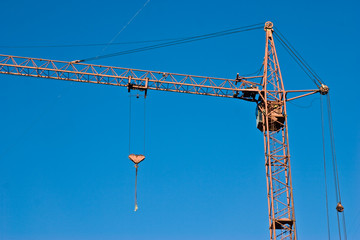 construction series: crane with gibbet on the blue sky