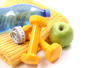 dumbbells towel water and apple - ready to fitness