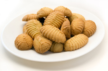 Sweet homemade butter cookies over white background