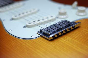 Fototapeta na wymiar Close-up of a Fender American Deluxe guitar bridge