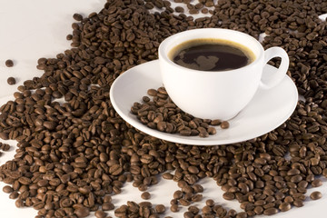Cup of coffee and coffee beans background