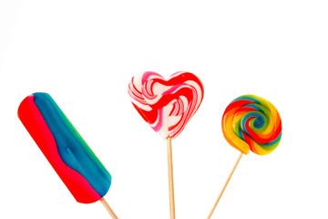 Colorful lollipops isolated over white background