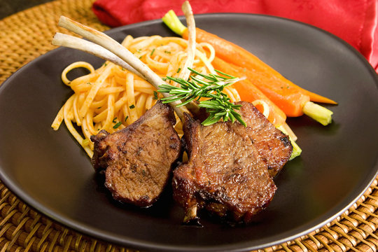 Lamb Rib Chops With Spaghetti And Carrots