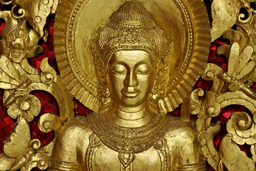 Fototapeta na wymiar Buddha Carving wewnątrz świątyni, Luang Prabang, Laos.