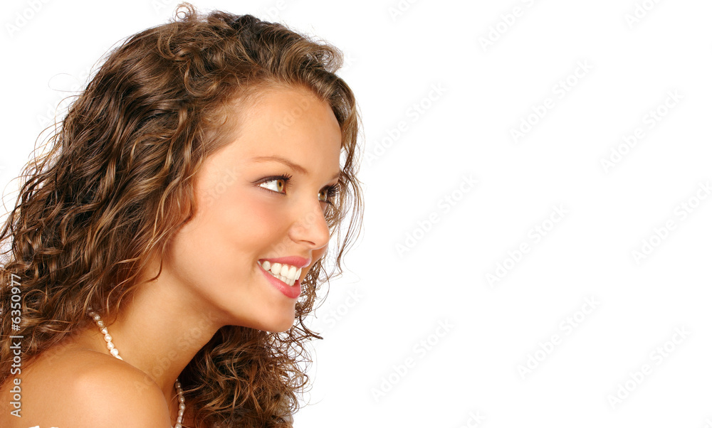 Wall mural Beautiful young woman face. Isolated over white background.