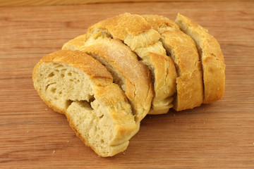 Bread slices on wooden board