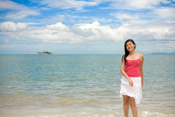 playful woman at the beach on a beautiful day