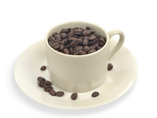 Coffee beans in creme cup.