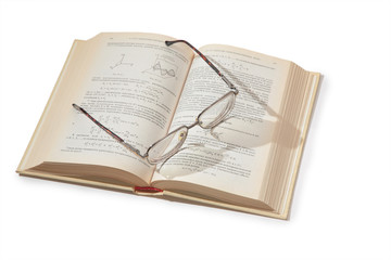 Obraz premium glasses on opening textbook