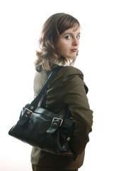 Business woman in suit with handbag looking over shoulder