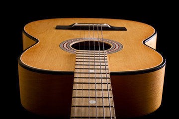 Close-up of classic acoustic guitar. Shallow DOF..