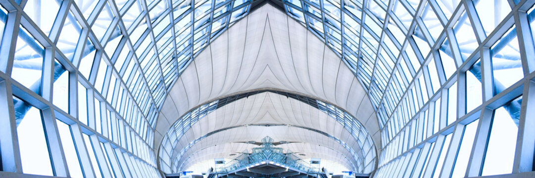 grey unusual geometric ceiling of office building, panorama