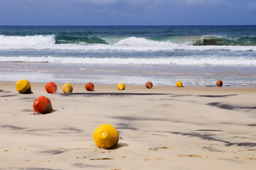 beach with signal buoys