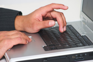Fototapeta na wymiar Typing on a laptop