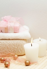 Relaxing spa scene with exfoliating sponge, face towel and soap 
