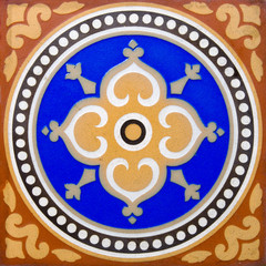 An antique flooring tile in the Arts & Crafts style 