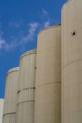 brewery tanks blue sky big containers beer production industry