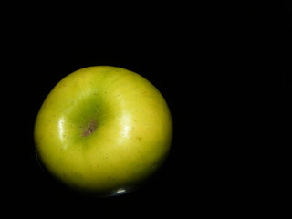 Green apple isolated on black