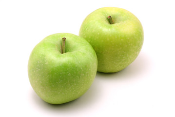two fresh, green apples on white