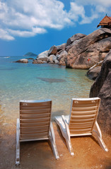 Fototapeta premium Two sunbeds on a private beach
