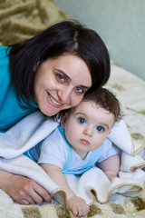 Mum embracing the small son to which 7 months