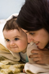 Mum embracing the small son to which 7 months