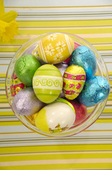 Easter eggs and yellow flower