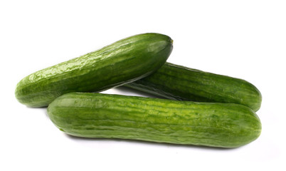 Fresh cucumbers on white
