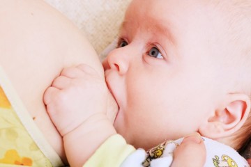 Beautiful baby beeing breastfed