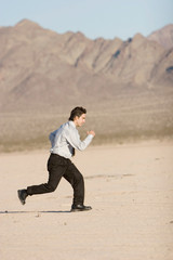 Young businessman running for success