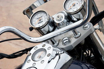 Classic motorcycle chrome parts closeup.