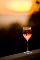 Shot of a glass of wine to enjoy the sunset with.