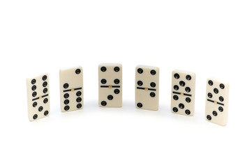 Various domino pieces isolated on the white