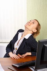 The business woman looks up in an office