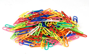 Isolated colorful pile of paper clips - good office background