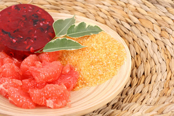bowl of grapefruit bath salt bar of soap and some fresh fruits