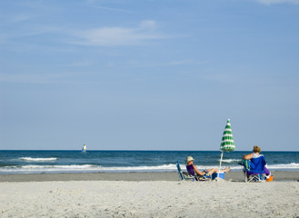 Couple on Beach Looking out to sea